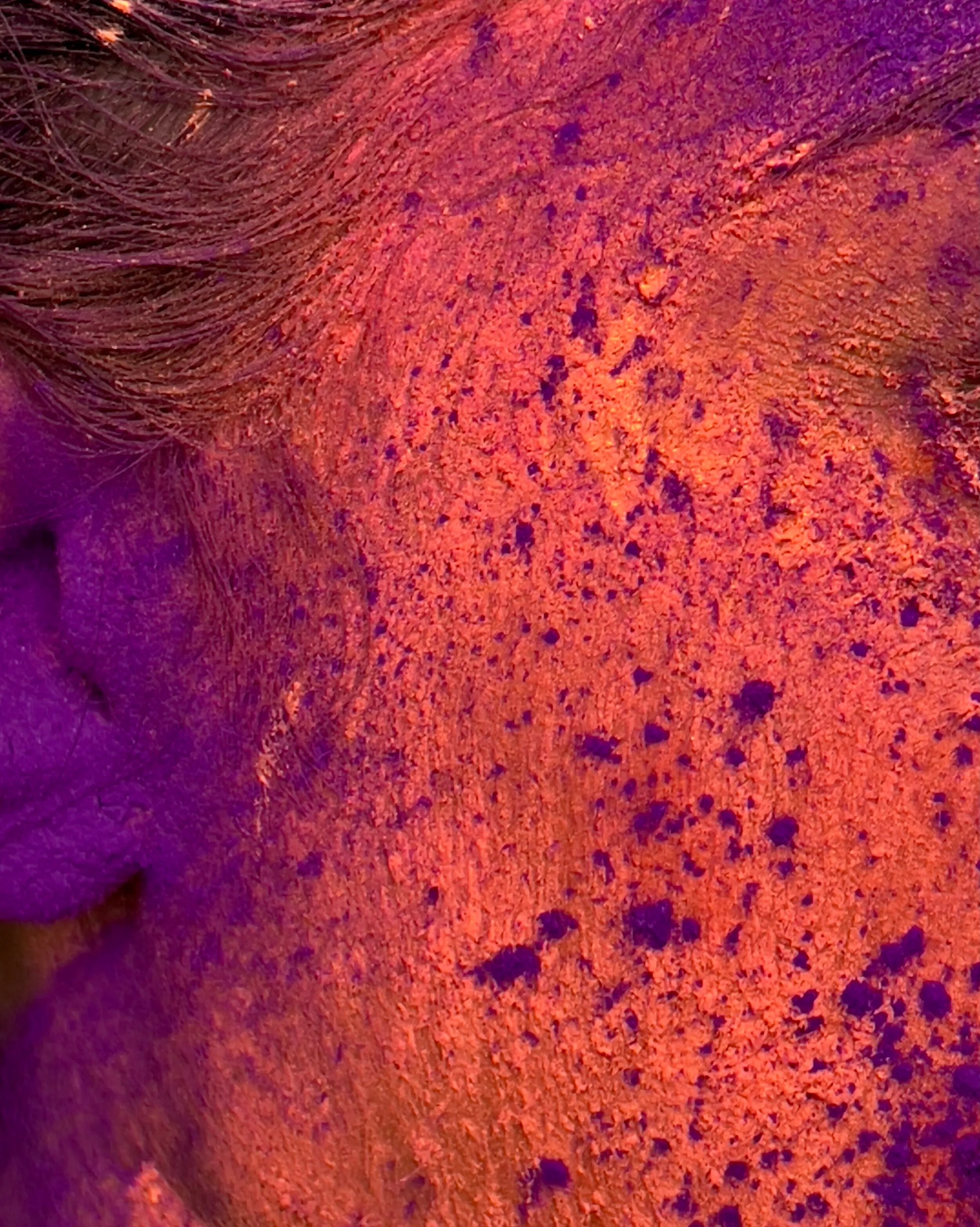 @apple Holi carousel, image seven — a face emerging from the colours