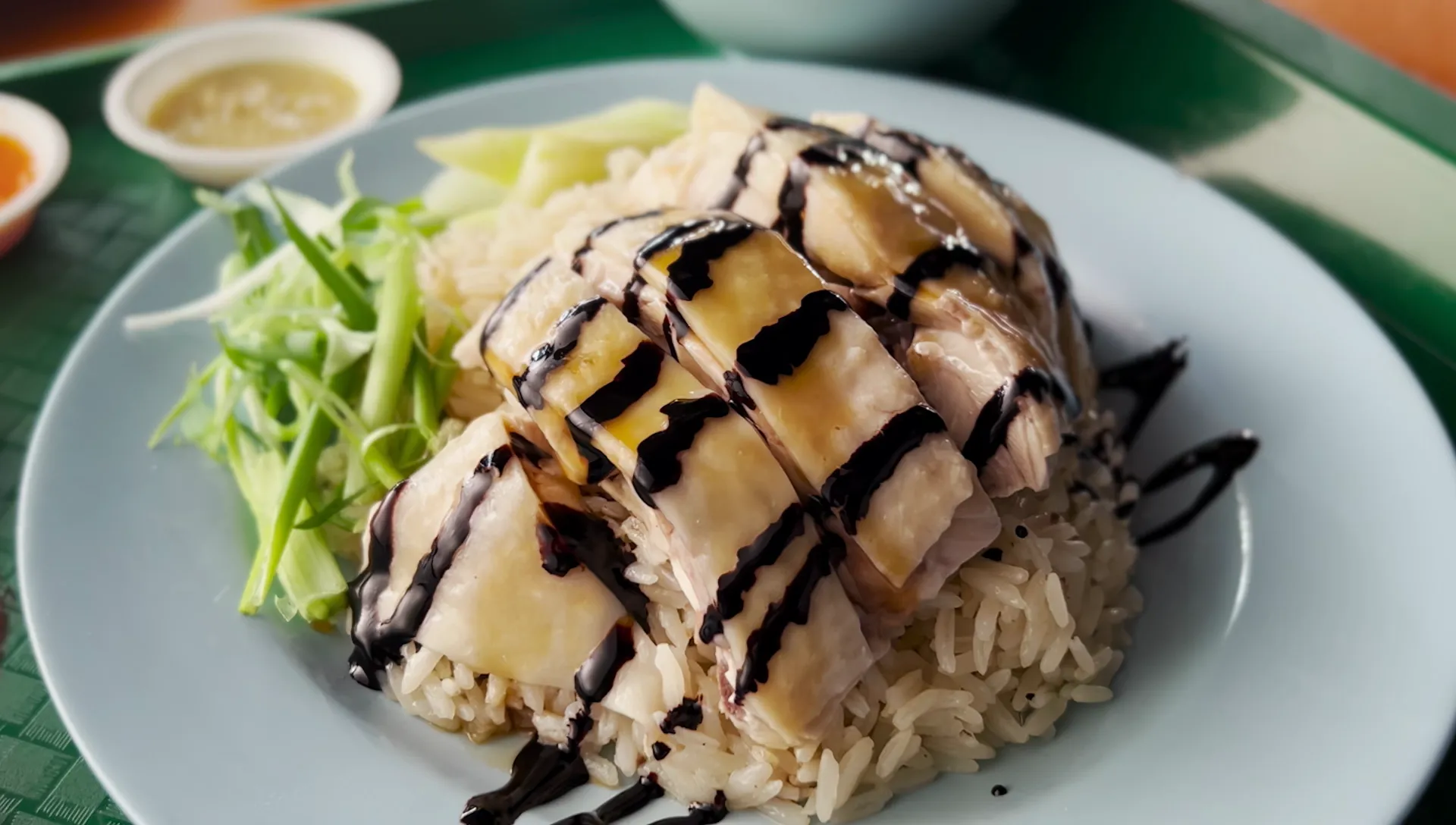 Poached documentary still — chicken rice preparation close-up