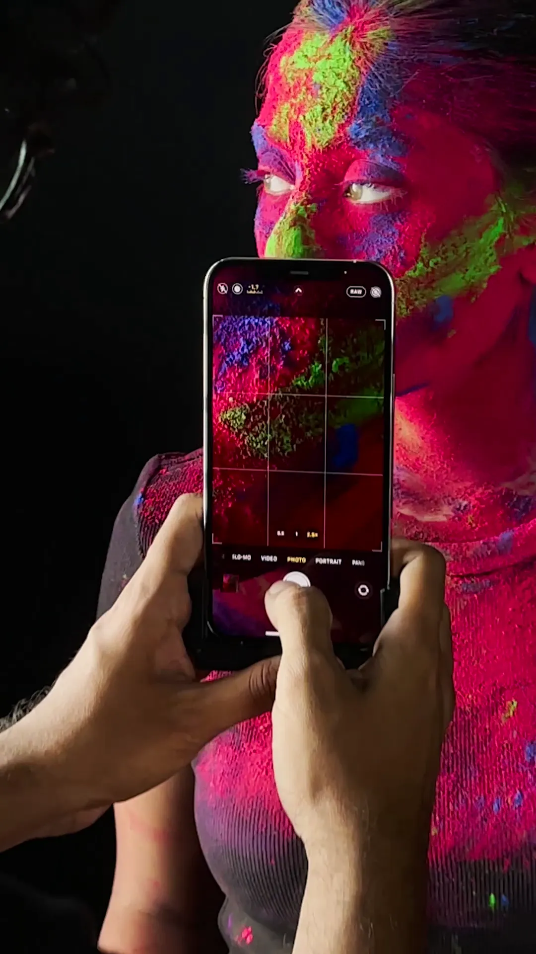 Holi story frame shot on iPhone 12 Pro Max — textures of gulal powder in close-up